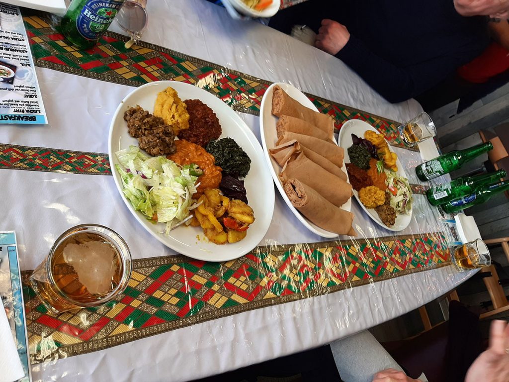 A selection of dishes including injera – a soft, spongy sourdough flatbread that resembles thick pancakes at the Red Sea Restaurant in Swansea.