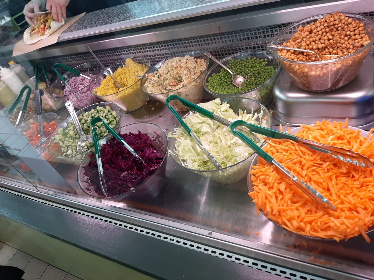The Falafel Stall in Swansea Market - freshly prepared salads, homemade hummus, and tasty sauces – all made using the freshest produce sourced from the market itself whenever possible