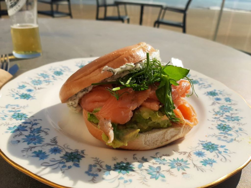 Smoked Salmon Brioche Bagel, filled with velvety cream cheese and slices of ripe avocado, all layered with delicately smoked salmon.