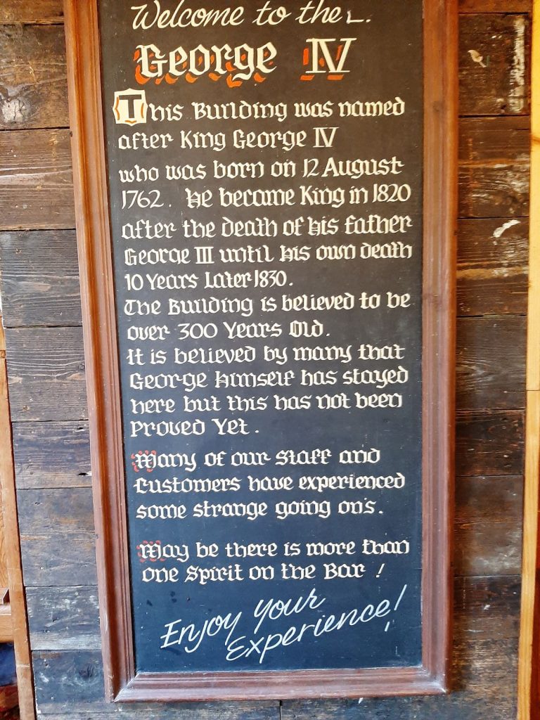 A sign inside the inn marks its dedication to King George IV at the 'The George IV Inn - Upper Cwmtwrch'