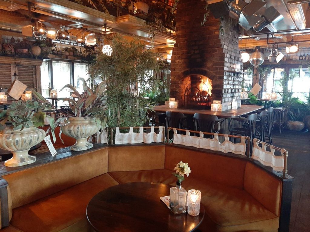 Cosy seating and fireplace at the Gin & Juice Mumbles Swansea