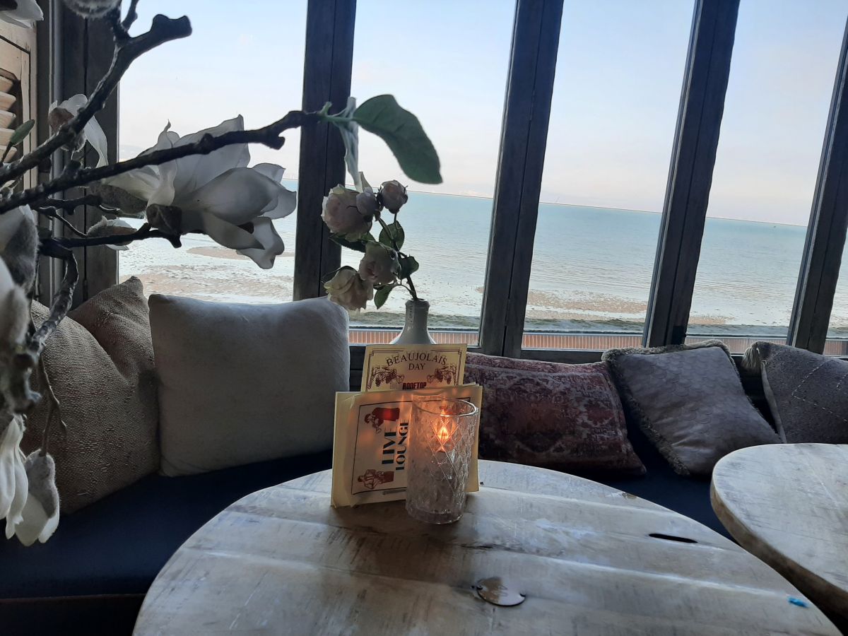 Seating and table overlooking Mumbles Seafront at the Gin & Juice Mumbles Swansea